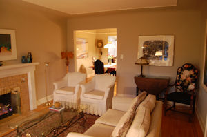 Relax beside the fire in Baker's Cottage living room.